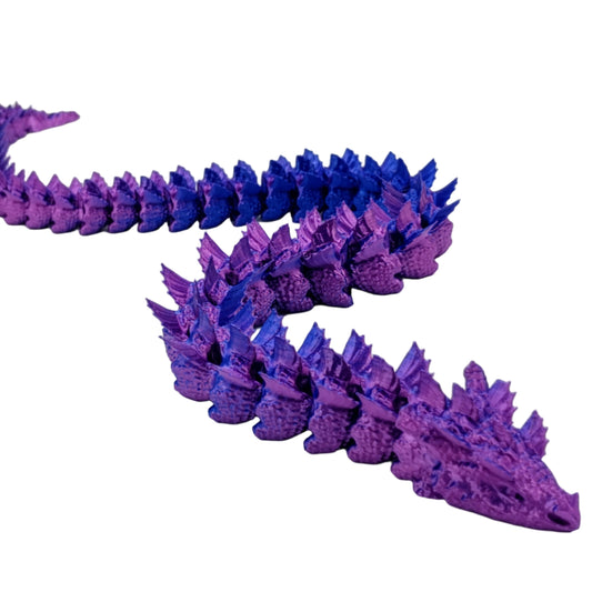 Purple and blue dragon-like creature model on a white background